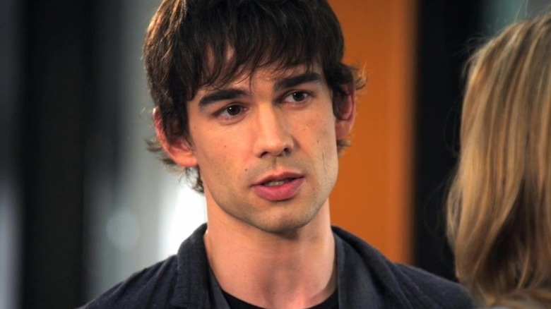Closeup of Auggie Anderson in a black jacket, speaking