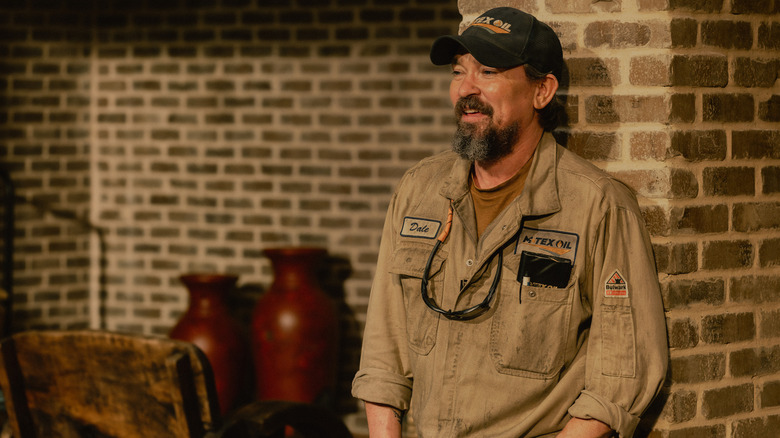 James Jordan as Dale laughing and leaning against pillar in "Landman"