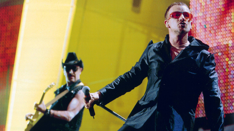 U2's The Edge and Bono performing live on stage