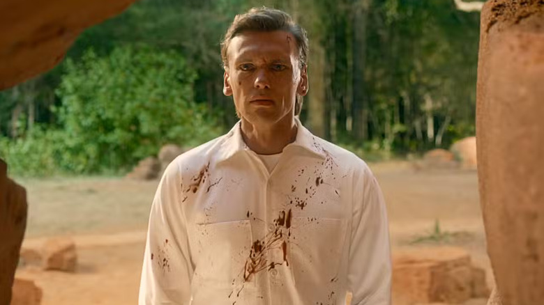 A frightened Henry Creel tearfully gazes into the cave from his memories on Stranger Things Season 5.