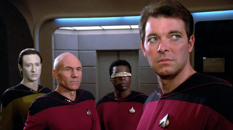 Brent Spiner's Data, Patrick Stewart's Jean-Luc Picard, LeVar Burton's Geordi LaForge, and Jonathan Frakes' William Riker looking concerned on Star Trek: The Next Generation