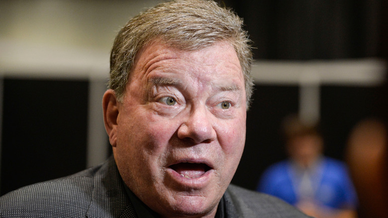 Th cast of "Star Trek: The Next Generation" against a starfield