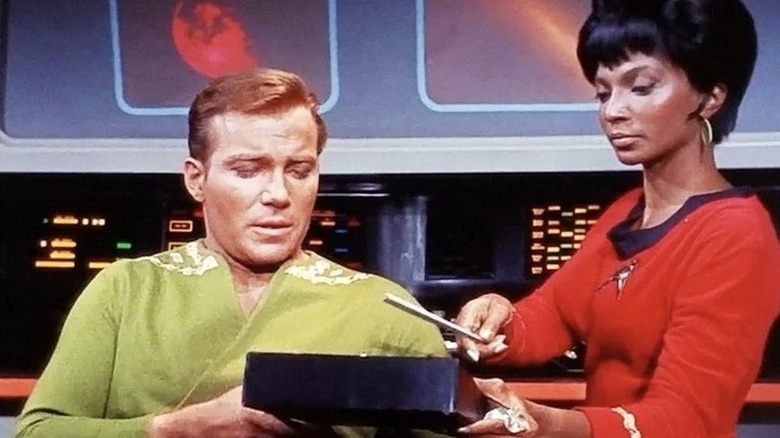 Captain James Kirk and Lieutenant Uhura on the bridge of the Enterprise
