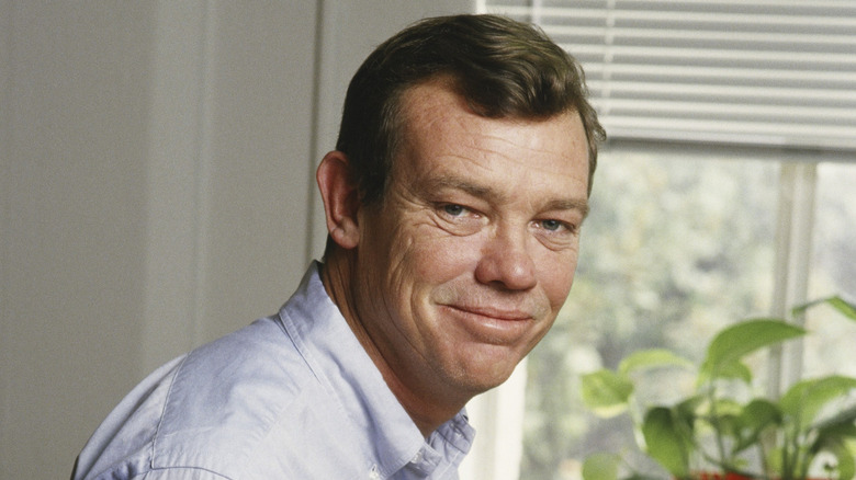 LOS ANGELES - 1987: Television screenwriter, producer and director, Hugh Wilson poses with a script during a 1987 Los Angeles, California, photo portrait session. Wilson wrote innovative shows including, "Frank's Place" and "WKRP."