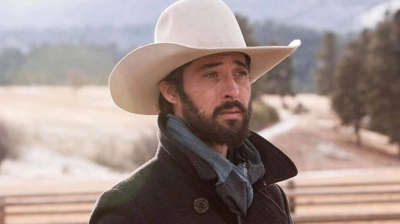 Walker standing in front of a scenic backdrop on Yellowstone (2018-2024)