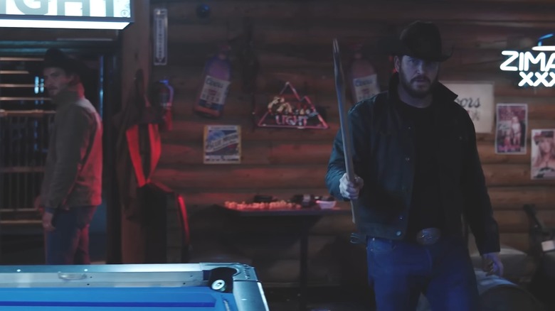 Rip (Cole Hauser) and Kayce (Luke Grimes) confront a bartender in Yellowstone