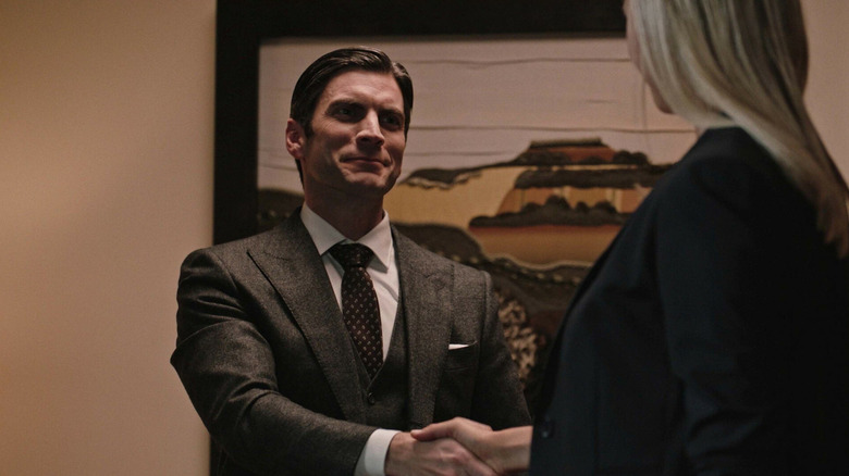 Jamie Dutton (Wes Bentley) shakes hands with a blonde woman in Yellowstone