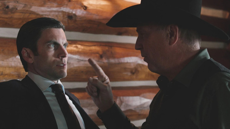 Jamie Dutton (Wes Bentley) is backed against a wall as John Dutton (Kevin Costner) sternly points a finger at him in Yellowstone