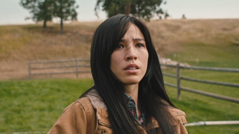 Monica Dutton (Kelsey Asbille) standing outside on "Yellowstone."