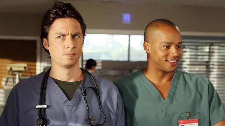J.D. looking suspicious and Turk looking happy on Scrubs