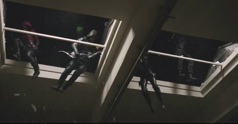 Team Arrow arrives via rooftop. Always a sweet move.