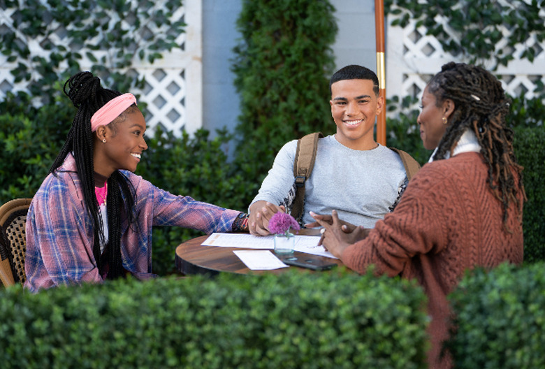 Naomi and Nathan hold hands